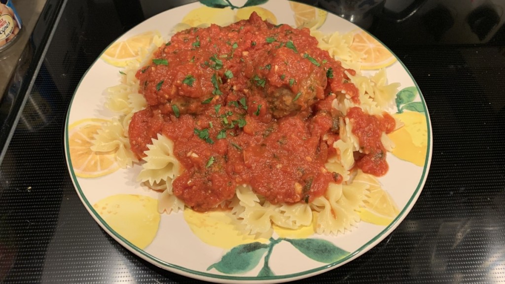 Bowtie pasta with meatballs.